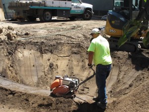 Monty with McKernan Enterprises compacts the soil.