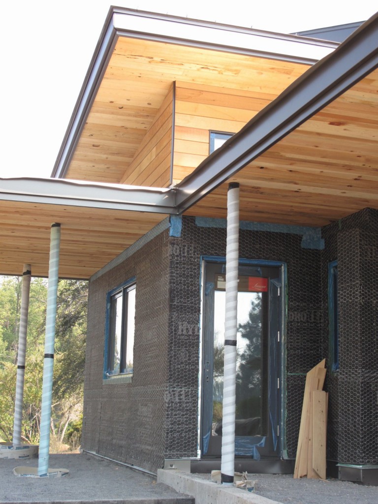 The plastering process began in July 2012 with the installation of chicken wire lathe on the exterior of the structures.