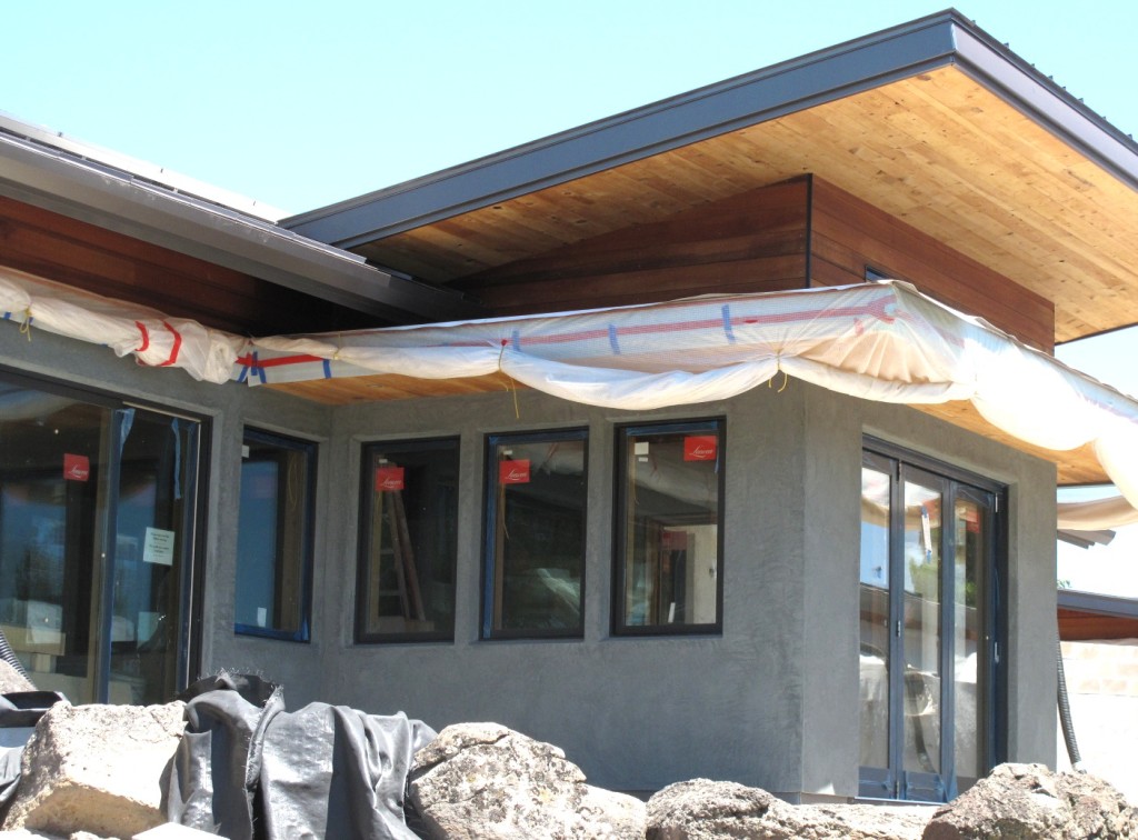 The south side of Desert Rain sporting the new color of the final coat of lime plaster.