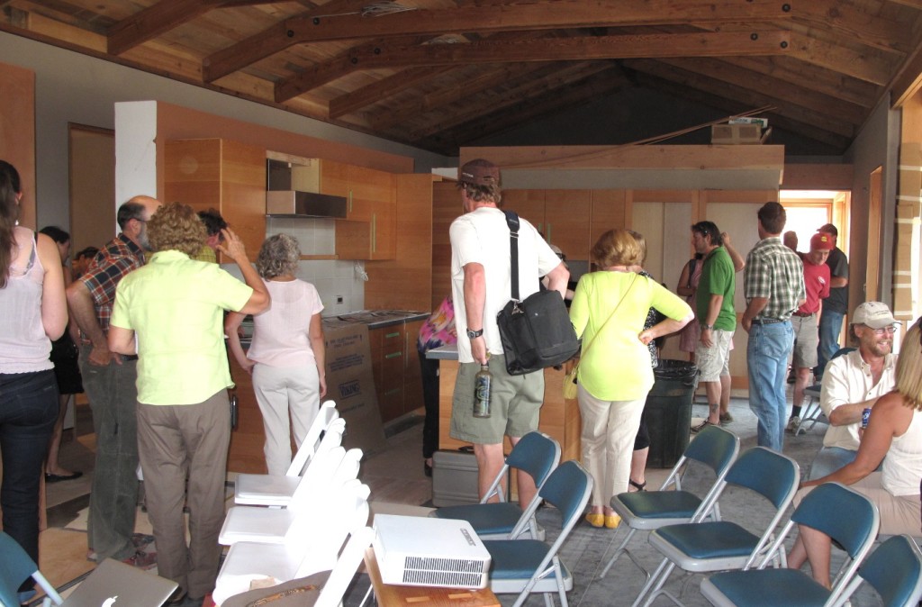 Visitors tour the home and explore the elements and materials.