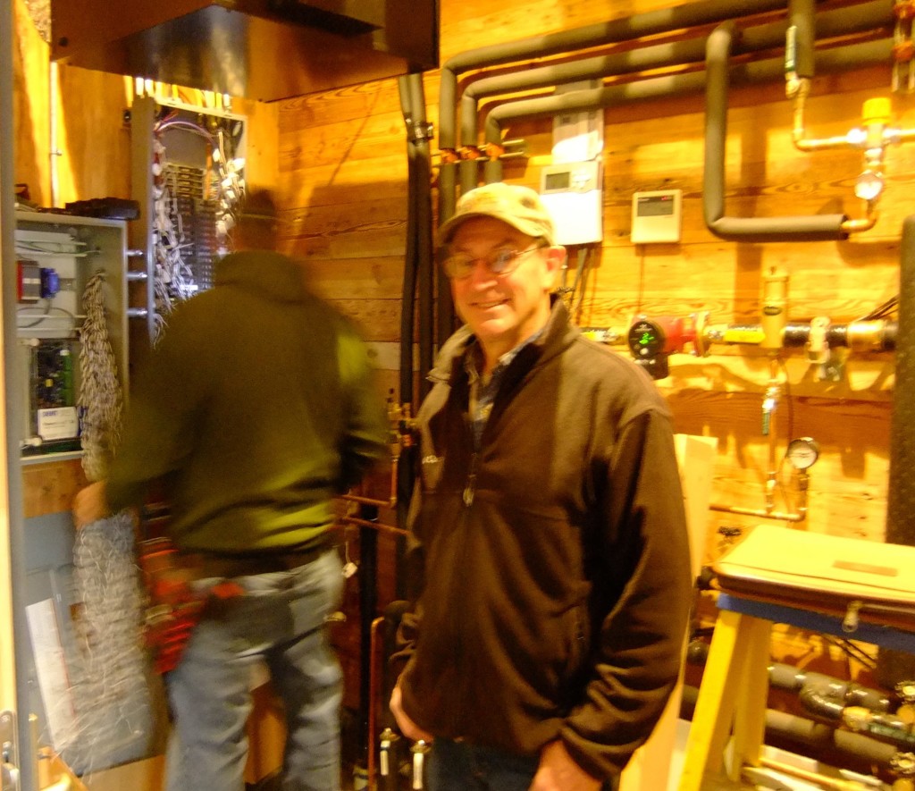 Dan McCullough, Project Manager with Powers of Automation in 'Mission Control' room. Mike Wagnon, electrician with All Phase Electric Service works on installing the control panels in the background.